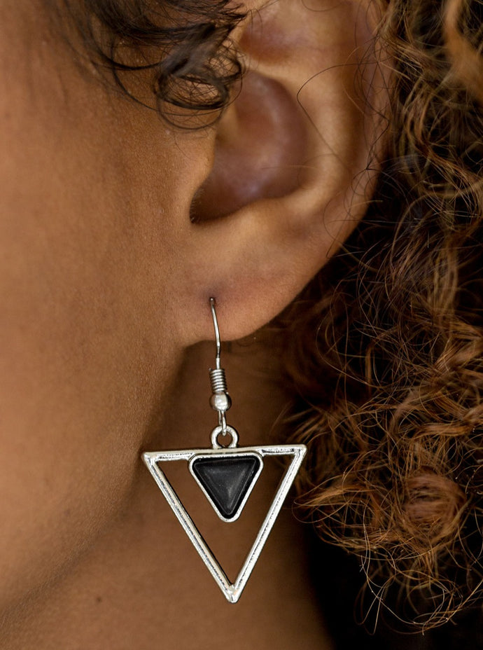 Chiseled into a dainty triangle, a black stone is pressed into the top of a triangular frame for an artisan inspired look. Earring attaches to a standard fishhook fitting.  Sold as one pair of earrings.