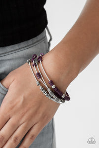 Mismatched silver accents and disc shaped purple beading slides along stretchy spring-like wires for a spunky tribal look.  Sold as one set of four bracelets.  Always nickel and lead free.