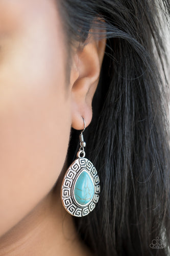 Chiseled into a tranquil teardrop, a refreshing turquoise stone is pressed into the center of a silver frame embossed in spiraling patterns for a tribal look. Earring attaches to a standard fishhook fitting.  Sold as one pair of earrings.  Always nickel and lead free.