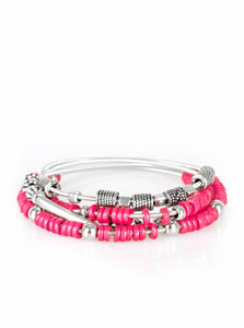 Mismatched silver accents and disc shaped pink beading slides along stretchy spring-like wires for a spunky tribal look.  Sold as one set of four bracelets.