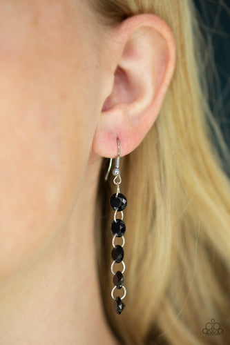 Glassy black prisms are threaded along dainty silver links as they trickle from the ear, coalescing into a timeless lure. Earring attaches to a standard fishhook fitting.  Sold as one pair of earrings.   Always nickel and lead free.