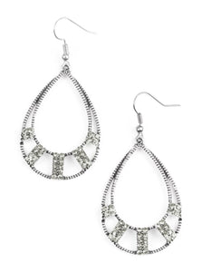 Sections of smoky rhinestone encrusted frames adorn the bottom of an ornate silver teardrop, creating a refined lure. Earring attaches to a standard fishhook fitting.  Sold as one pair of earrings.
