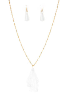 Featuring shimmery white thread, a 3-tiered tassel swings from the bottom of a lengthened gold chain for a colorful, wanderlust vibe. Features an adjustable clasp closure.  Sold as one individual necklace. Includes one pair of matching earrings.