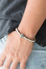 Load image into Gallery viewer, Black and off-white cording knot around the wrist, creating a colorful braid. Featuring floral like detail, a black bead adorns the center for a seasonal finish. Features an adjustable sliding knot closure.  Sold as one individual bracelet.   Always nickel and lead free.