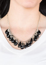 Load image into Gallery viewer, Polished black teardrops drip from the bottom of a shimmery silver chain, creating a colorful fringe below the collar. Featuring a delicately hammered surface, dainty silver teardrops are sprinkled along the chain for a splash of eye-catching shimmer. Features an adjustable clasp closure.  Sold as one individual necklace. Includes one pair of matching earrings. 