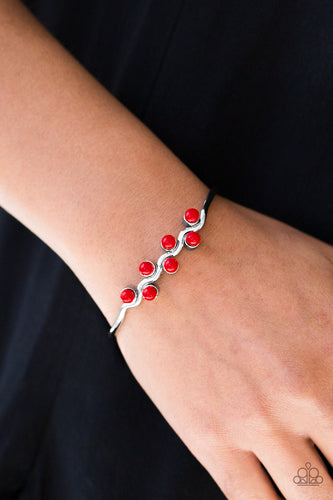 Fiery red beads are pressed down the center of a wavy silver cuff, creating a whimsical palette around the wrist.  Sold as one individual bracelet.  Always nickel and lead free.