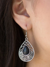 Load image into Gallery viewer, An earthy black stone is pressed into the center of a shimmery silver teardrop radiating with dotted and frilly filigree textures for a seasonal look. Earring attaches to a standard fishhook fitting.  Sold as one pair of earrings.