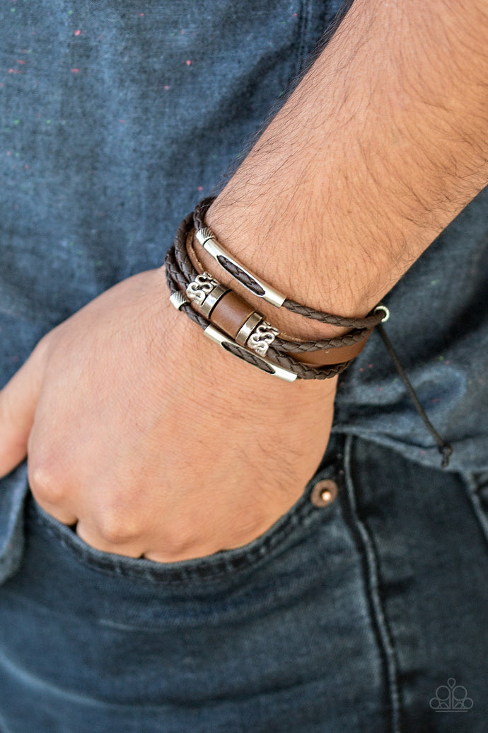 Infused with metallic accents, mismatched strands of braided leather cording and thick leather bands layer across the wrist for a rugged look. Features an adjustable sliding knot closure.  Sold as one individual bracelet.  Always nickel and lead free.
