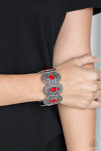 Load image into Gallery viewer, Faceted red beads are pressed into rounded silver frames radiating with tribal inspired textures. The ornate frames are threaded along stretchy bands around the wrist for a seasonal fashion.  Sold as one individual bracelet.  Always nickel and lead free.