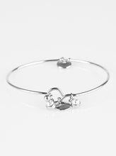 Load image into Gallery viewer, Glistening silver discs and glittery white rhinestones slide along a dainty bangle for a refined look. Features a toggle clasp.  Sold as one individual bracelet.