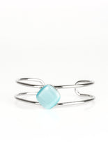Load image into Gallery viewer, Chiseled into a tranquil square, a glowing blue moonstone is pressed into the center of an airy silver cuff for a perfect pop of color.  Sold as one individual bracelet.