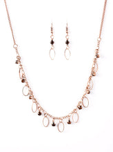Load image into Gallery viewer, Glittery rhinestones and dainty copper frames swing from a copper chain, creating a twinkling vintage fringe below the collar. Features an adjustable clasp closure.  Sold as one individual necklace. Includes one pair of matching earrings.