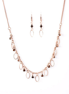 Glittery rhinestones and dainty copper frames swing from a copper chain, creating a twinkling vintage fringe below the collar. Features an adjustable clasp closure.  Sold as one individual necklace. Includes one pair of matching earrings.