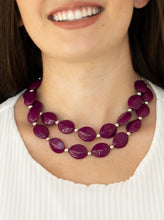 Load image into Gallery viewer, Two rows of dainty silver beads and faceted Magenta Purple faux stone beads alternate along invisible wires below the collar, creating bold, colorful layers. Features an adjustable clasp closure.  Sold as one individual necklace. Includes one pair of matching earrings.  