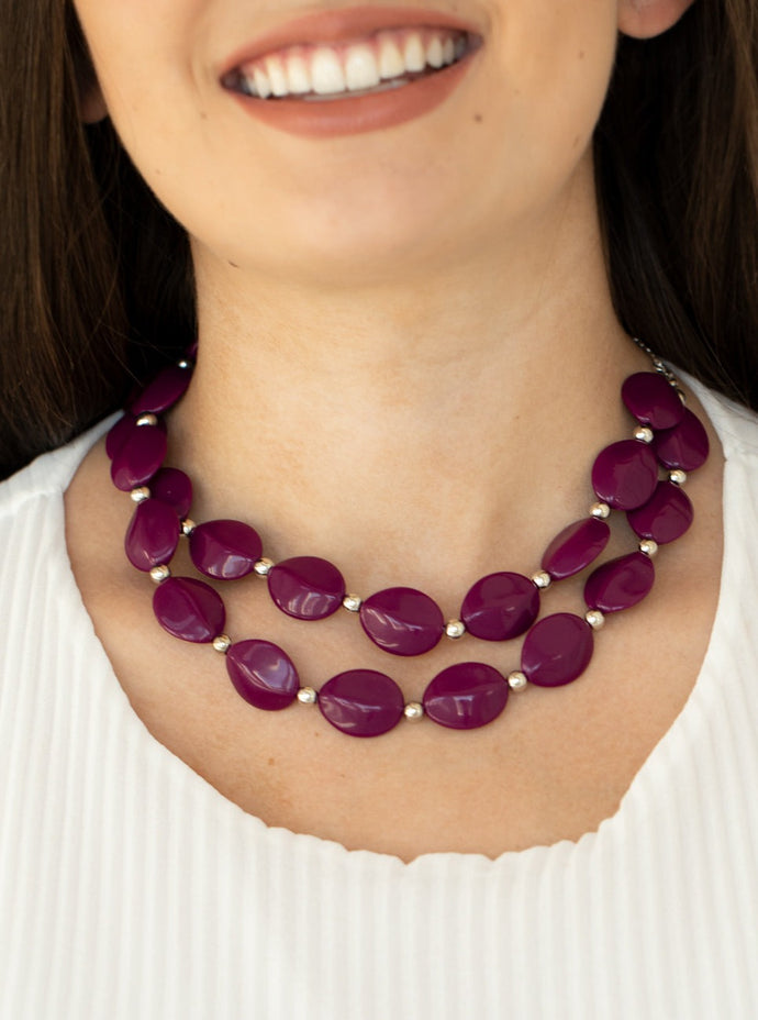 Two rows of dainty silver beads and faceted Magenta Purple faux stone beads alternate along invisible wires below the collar, creating bold, colorful layers. Features an adjustable clasp closure.  Sold as one individual necklace. Includes one pair of matching earrings.  