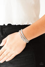 Load image into Gallery viewer, Infused with a strand of faceted smoky and classic silver beads, shiny gray cording knots around mismatched beads for an edgy look. Features an adjustable sliding knot closure.  Sold as one individual bracelet.  Always nickel and lead free.