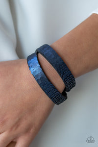 Row after row of shimmery sequins are stitched across the front of a lengthened black suede band. The elongated band allows for a trendy double wrap design. Bracelet features reversible sequins that change from silver to blue. Features an adjustable snap closure.  Sold as one individual bracelet.  Always nickel and lead free.