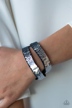 Load image into Gallery viewer, Row after row of shimmery sequins are stitched across the front of a lengthened black suede band. The elongated band allows for a trendy double wrap design. Bracelet features reversible sequins that change from silver to blue. Features an adjustable snap closure.  Sold as one individual bracelet.  Always nickel and lead free.