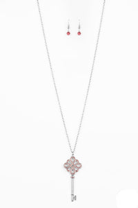 Encrusted in dazzling pink rhinestones, a shimmery silver key pendant swings from the bottom of a lengthened silver chain for a vintage inspired look. Features an adjustable clasp closure.  Sold as one individual necklace. Includes one pair of matching earrings.