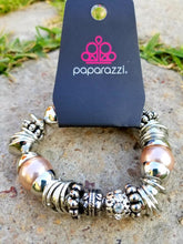 Load image into Gallery viewer, A mishmash of bold silver rings, refreshing brown pearls, and ornate silver beads accents are threaded along a stretchy elastic band.  White rhinestone encrusted beads are sprinkled between for a sparkling finish.  Sold as one individual bracelet.  By Paparazzi Accessories.  EXCLUSIVE~