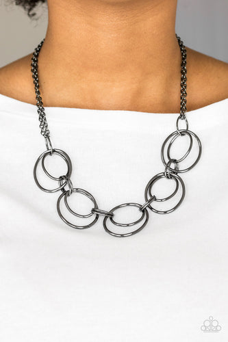 Doubled gunmetal hoops link below the collar for a bold industrial look. Features an adjustable clasp closure.  Sold as one individual necklace. Includes one pair of matching earrings.  Always nickel and lead free.