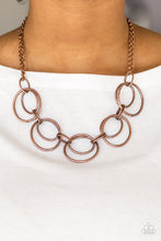 Load image into Gallery viewer, Doubled copper hoops link below the collar for a bold industrial look. Features an adjustable clasp closure.  Sold as one individual necklace. Includes one pair of matching earrings.  Always nickel and lead free.