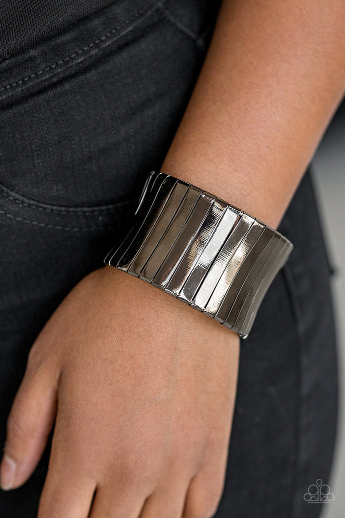 Flat gunmetal frames wrap around a gunmetal frame, creating a bold cuff around the wrist.  Sold as one individual bracelet.  Always nickel and lead free. 