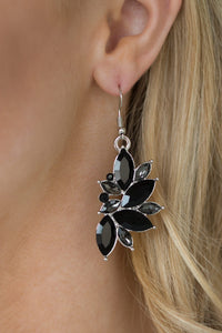 Varying in size, regal black and smoky marquise-shaped rhinestones coalesce into a dramatic lure. Earring attaches to a standard fishhook fitting.  Sold as one pair of earrings.