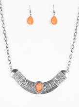 Load image into Gallery viewer, Embossed in floral and tribal inspired patterns, a shimmery silver crescent shaped frame swings below the collar in a fierce fashion. Chiseled into a tranquil teardrop, a vivacious orange stone is pressed into the center of the dramatic pendant for a seasonal finish. Features an adjustable clasp closure.  Sold as one individual necklace. Includes one pair of matching earrings.