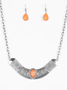 Embossed in floral and tribal inspired patterns, a shimmery silver crescent shaped frame swings below the collar in a fierce fashion. Chiseled into a tranquil teardrop, a vivacious orange stone is pressed into the center of the dramatic pendant for a seasonal finish. Features an adjustable clasp closure.  Sold as one individual necklace. Includes one pair of matching earrings.