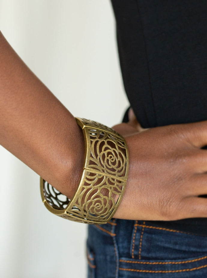  Filled with floral-like filigree, antiqued brass rectangular frames are threaded along stretchy bands around the wrist for a vintage inspired look.  Featured inside The Preview at ONE Life!   Sold as one individual bracelet. 