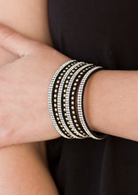 Load image into Gallery viewer, Shiny gold studs and rows of glittery white rhinestones are encrusted along strips of black suede, creating sassy shimmer around the wrist. Features an adjustable snap closure.  Sold as one individual bracelet. 
