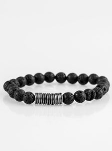 Infused with antiqued metallic accents, earthy black lava stones are threaded along a stretchy elastic band for a seasonal look.  Sold as one individual bracelet.