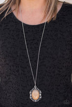 Load image into Gallery viewer, Featuring a faux rock finish, a shiny brown bead is pressed into the center of a frilly silver frame radiating with studded details. The dramatic pendant swings from the bottom of a lengthened silver chain for a vintage inspired look. Features an adjustable clasp closure.  Sold as one individual necklace. Includes one pair of matching earrings.   Always nickel and lead free. 