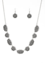 Load image into Gallery viewer, Encrusted in glittery hematite rhinestones, ornate filigree filled silver frames link below the collar for a vintage inspired style. Features an adjustable clasp closure.  Sold as one individual necklace. Includes one pair of matching earrings. 