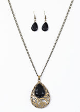 Load image into Gallery viewer, Featuring a regal teardrop shape, a faceted black bead is pressed into a larger brass teardrop, creating a whimsical pendant. Brushed in an antiqued shimmer, airy filigree climbs the bold pendant for a vintage inspired look. Features an adjustable clasp closure.  Sold as one individual necklace. Includes one pair of matching earrings.