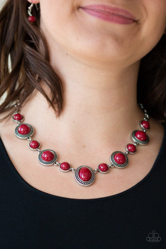 Featuring smooth and studded silver frames, rich red beads link below the collar in a seasonal fashion. Features an adjustable clasp closure.  Sold as one individual necklace. Includes one pair of matching earrings.  Always nickel and lead free.
