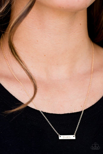 Stamped in the inspired word “faith,” a dainty gold plate hangs from a shimmery gold chain just below the collar for a causal look. Features an adjustable clasp closure.  Sold as one individual necklace. Includes one pair of matching earrings.