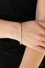 Load image into Gallery viewer, Encrusted in ribbons of glassy white rhinestones, hammered gold frames are threaded along a stretchy band around the wrist for a refined look.  Sold as one individual bracelet.  Always nickel and lead free.