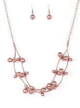 Load image into Gallery viewer, Cylindrical copper beads and clusters of pearly copper beads are threaded along invisible wires, creating bubbly layers below the collar for a refined look. Features an adjustable clasp closure.  Sold as one individual necklace. Includes one pair of matching earrings.