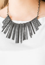 Load image into Gallery viewer, Embossed in edgy linear patterns, flat gunmetal rods alternate with plain gunmetal rods below the collar, creating a fiercely tapered fringe. Features an adjustable clasp closure.  Sold as one individual necklace. Includes one pair of matching earrings.