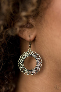 Brushed in an antiqued shimmer, frilly filigree dances along the outside of a brass hoop, creating a whimsical floral inspired lure. Earring attaches to a standard fishhook fitting.  Sold as one pair of earrings.  