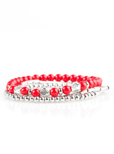 Fiery red beads and silver beads featuring round and cylindrical shapes are threaded along elastic stretchy bands. Stamped in tree-like patterns, faceted silver beads are sprinkled between the colorful beads for a whimsical finish.  Sold as one set of three bracelets.