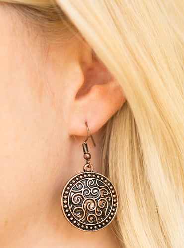 Brushed in an antiqued shimmer, a studded copper disc is embossed in vine-like filigree for a whimsical look. Earring attaches to a standard fishhook fitting.  Sold as one pair of earrings.