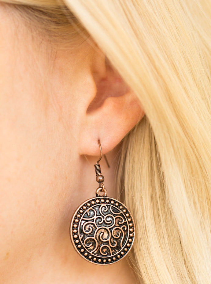 Brushed in an antiqued shimmer, a studded copper disc is embossed in vine-like filigree for a whimsical look. Earring attaches to a standard fishhook fitting.  Sold as one pair of earrings.