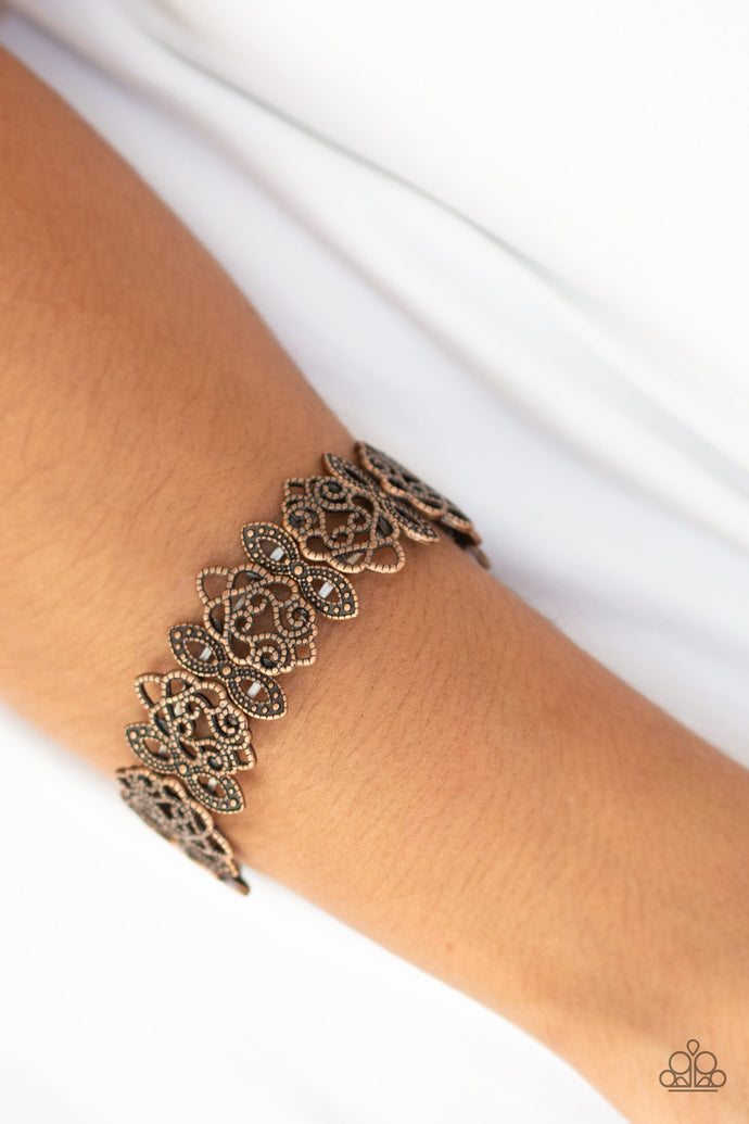Radiating with studded detail, ornate copper filigree frames are threaded along stretchy bands around the wrist for a whimsical look.  Sold as one individual bracelet.  Always nickel and lead free.