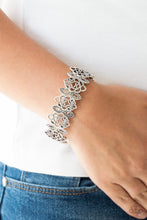 Load image into Gallery viewer, Radiating with studded detail, ornate silver filigree frames are threaded along stretchy bands around the wrist for a whimsical look.  Sold as one individual bracelet.  Always nickel and lead free.