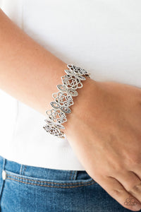 Radiating with studded detail, ornate silver filigree frames are threaded along stretchy bands around the wrist for a whimsical look.  Sold as one individual bracelet.  Always nickel and lead free.