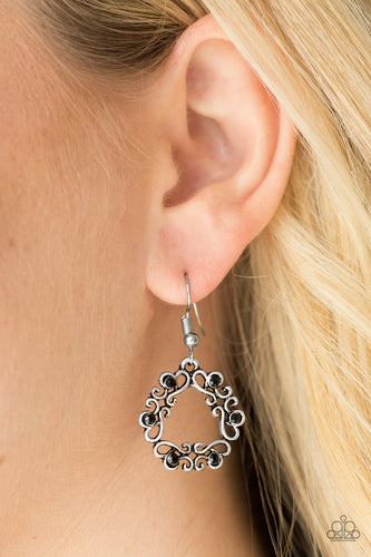 Glistening silver filigree joins into an airy wreath. Dainty black rhinestones are sprinkled across the whimsical palette for a colorful finish. Earring attaches to a standard fishhook fitting.  Sold as one pair of earrings.  Always nickel and lead free.