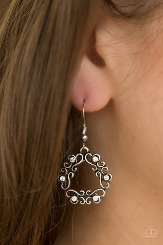 Glistening silver filigree joins into an airy wreath. Dainty white rhinestones are sprinkled across the whimsical palette for a colorful finish. Earring attaches to a standard fishhook fitting.  Sold as one pair of earrings.  Always nickel and lead free.
